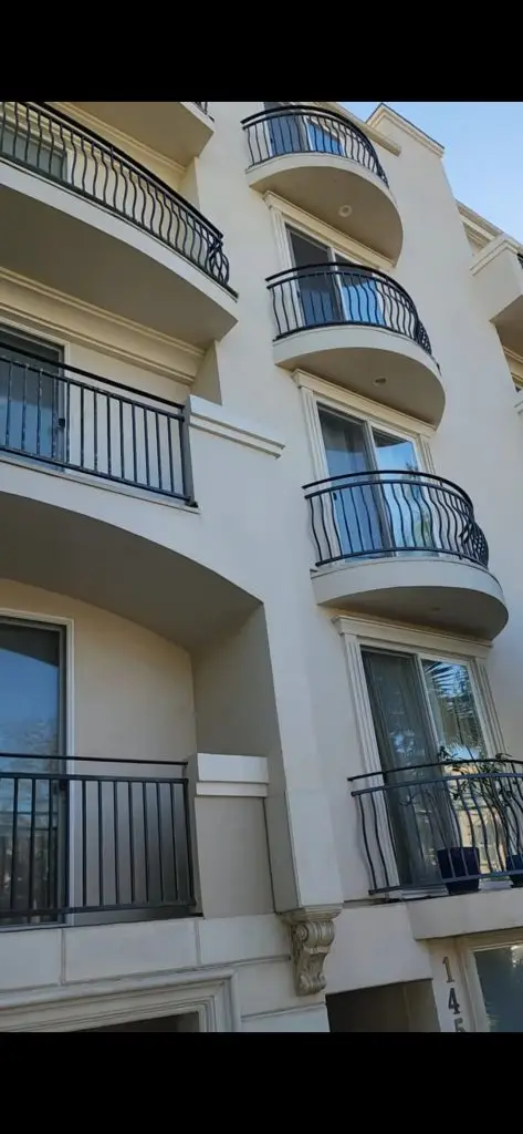 Old Railings, New Safety Standards: A Guide for Los Angeles Property Owners 8 Older Los Angeles buildings with wrought iron balcony railings showing common safety concerns